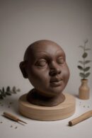 Ethnic Black Terracotta Baby Face Sculpture – Handmade Accent